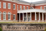A photo of the University of Kentucky campus, showing the university’s name on a stone sign.