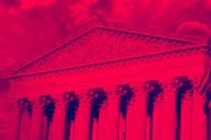 Facade of U.S. Supreme Court with a red-colored filter applied.
