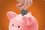 A photo illustration of a hand dropping a quarter into a piggy bank.
