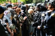 Police and pro-Palestinian protesters stand-off