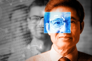 A man wearing glasses with technology overlaid to "digitize" him