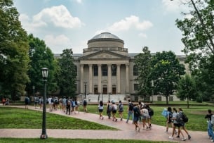 Students walk through a college campus