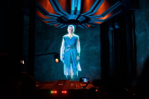 Princess Leia appears as a hologram - glowing, floating in a blue dress
