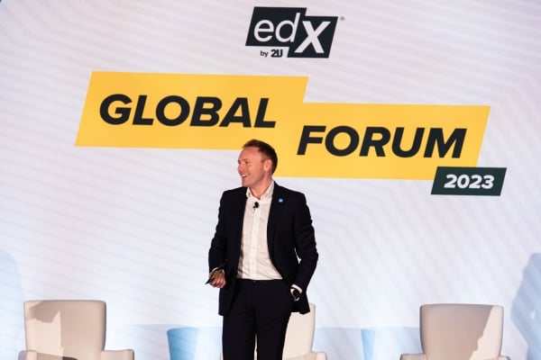 Andrew Hermalyn, a light-skinned man wearing a suit with no tie, at the edX Global Forum in 2023