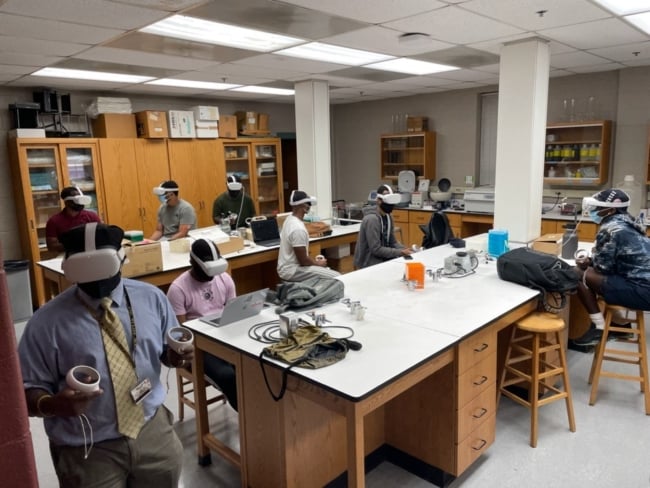 Morehouse College students utilizing the meta headsets in a microbiology class. 