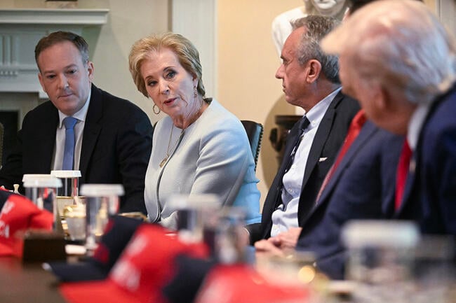U.S. Education Secretary Linda McMahon, sitting at a table with other members of the cabinet.