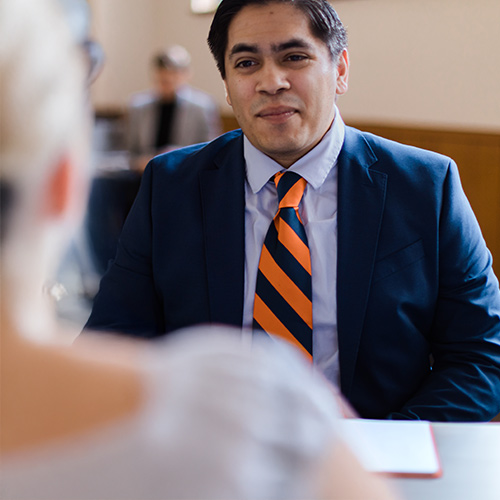 A young man in a suit interviewing for a job.