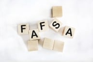 An assortment of wooden blocks that spell "FAFSA."