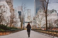 Young woman walks through Central Park in New York