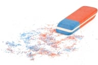 blue and orange eraser with shavings as if something has been rubbed out, like a letter or two