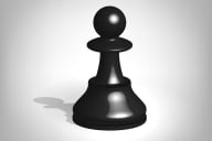 A single black chess pawn against a gray background.