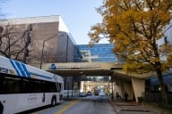 A bus passes under a sign on Georgia State University's campus in Atlanta, Georgia.