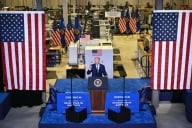 Joe Biden stands at a podium inside Gateway Technical College 