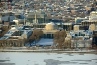 An aerial view of Massachusetts Institute of Technology's urban campus, with the Great Dome visible in the center.