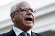 Minnesota governor Tim Walz, a light-skinned man with white hair and glasses, speaks outside the White House