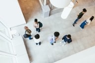 High-angle view on group of people in the large hall or lobby.