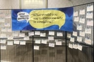 A three-panel display with a blue sign that reads "Send silence packing, 'What would you say to someone who is struggling?'" 