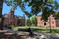 A photograph of West Virginia University's central quad, with Woodburn Hall on the left.