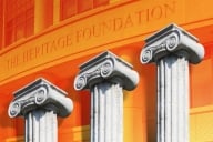 A photo illustration with three columns superimposed over a photograph, shaded orange, of the front of the Heritage Foundation headquarters.