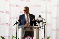 Walter Kimbrough, interim president of Talladega College, stands at a podium.