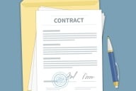 An illustration of a document that says "Contract" at the top, atop a folder and next to a pen.