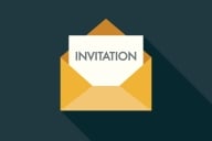 An illustration of a card that reads "INVITATION" in an open envelope against a dark background.