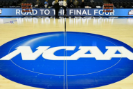 Basketball court with NCAA logo at halfcourt