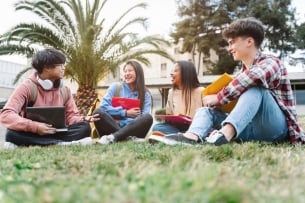 College students sitting and talking in nice weather