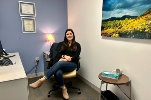 Hannah Nunez sitting in an office