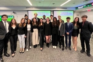 Babson College SPEAR students smile for a photo