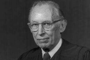 A black and white portrait of Supreme Court justice Lewis Powell, an older white man.