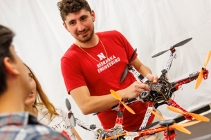 A University of Nebraska-Lincoln student holds a drone.