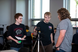 Three Western Illinois University students work together in a physics course.