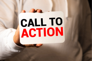 A close-up of a hand holding a sign that reads "Call to Action."