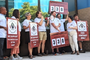 A photograph of American Association of University Professors staff members protesting outside the Washington, D.C., headquarters.