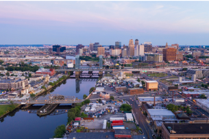 A view of Newark, N.J., featuring buildings near the river.