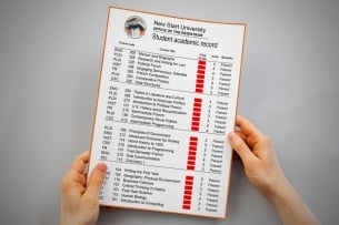 An illustration of a college student's transcript with grades redacted in red.