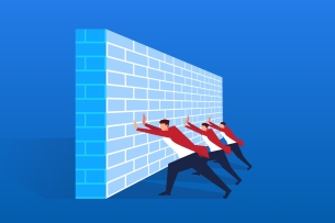 Three men push against a wall-like barrier