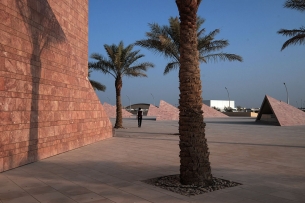 Palm trees and structures in the desert