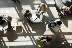 An aerial shot of students working in a common space