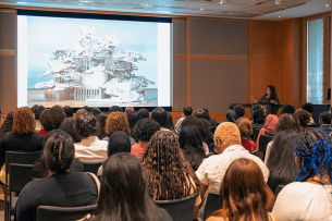 The 2023 cohort of New York City Bloomberg Arts Internship students watch a presentation at the Metropolitan Museum of Art.