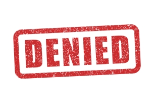 A graphic of the word "denied," stamped in red, against a white background.