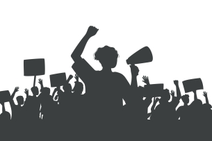 A silhouette of protesters against a white background. The figure in the front of the image has an arm raised and is obviously shouting into a bullhorn. Behind this figure, other protesters hold signs in the air.