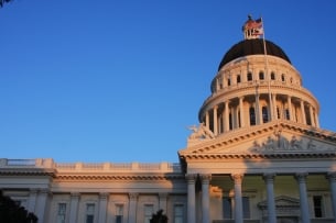 The California legislature building is toward the right of the photo. There are slight shadows across the building 