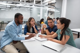 Group of students studying together in the classroom