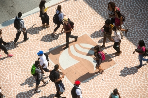 Students walk on Georgia State's campus on a sunny day.