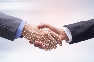 close-up businessman handshake with business artificial intelligence on motion blur background for future technology concept