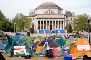 Tents of different colors sit on a lawn at Columbia University