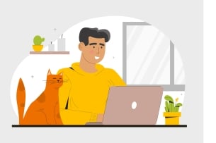 An image of a smiling man at a desk at a home office, his laptop open in front of him, with a happy orange cat sitting alongside him.