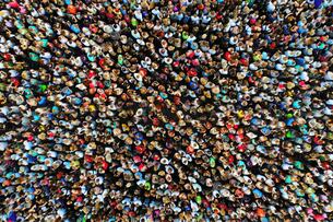 A photo of a large crowd of people gathered in one place, taken from overhead with a drone.